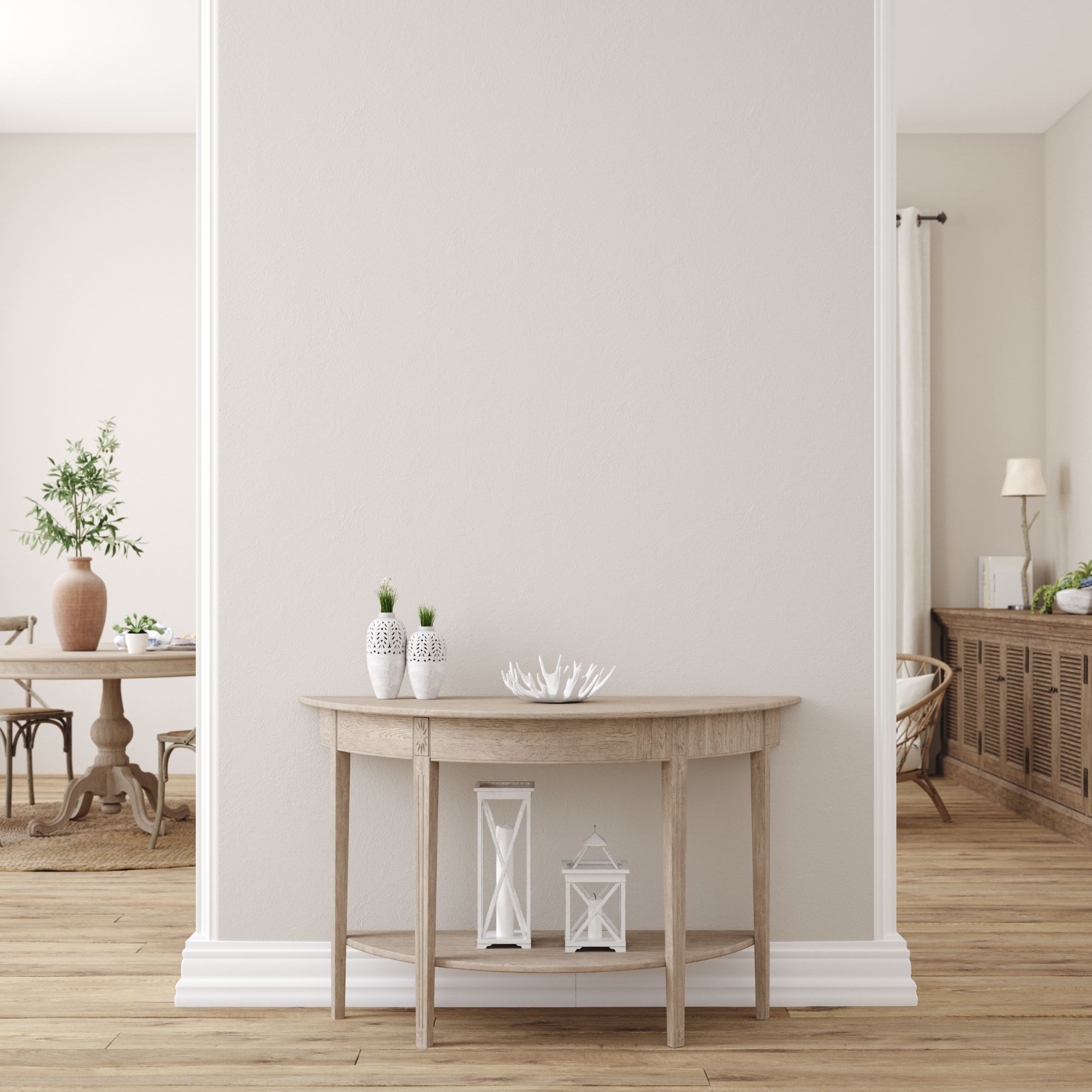 Scandinavian-style entryway with light wood console table, potted plants, and white decorative lanterns